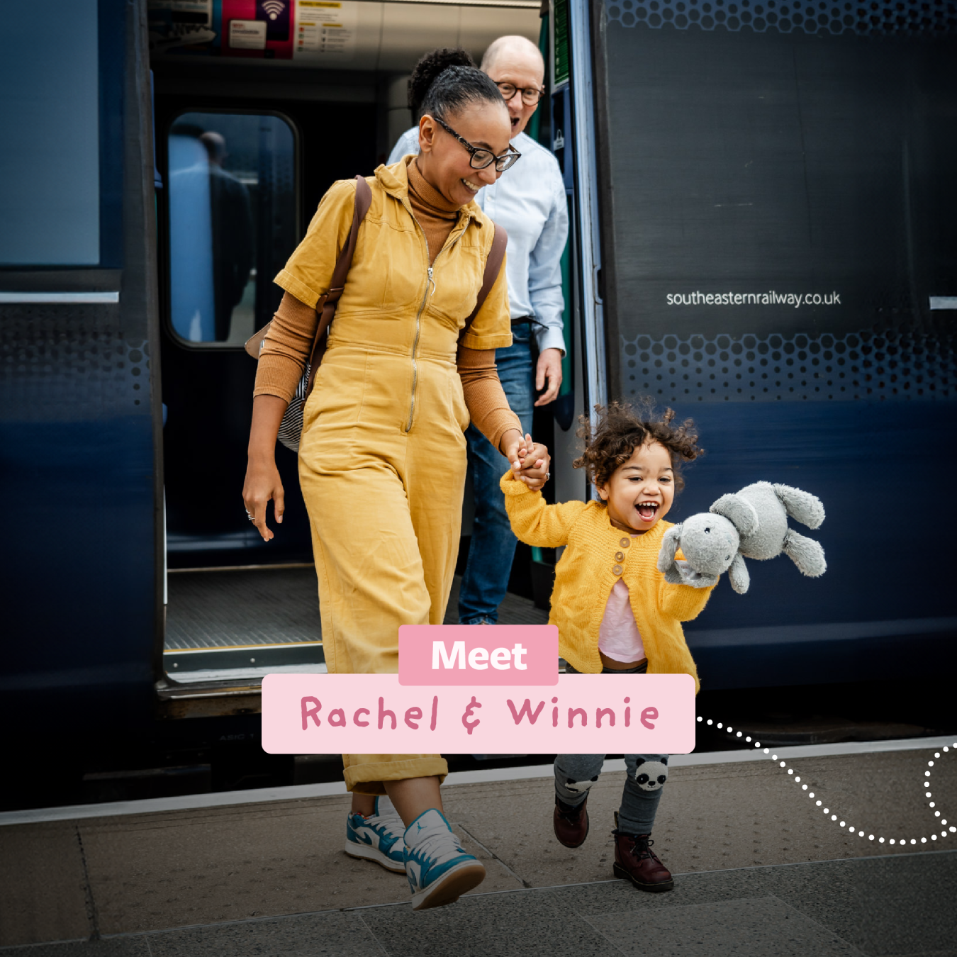 happy mum and toddler daughter both in Yellow, step of a train followed by grandad