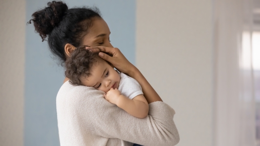 Mum comforting baby